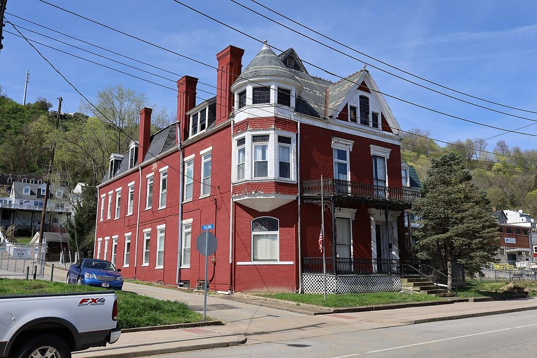 A row of brick houses on a hillside street